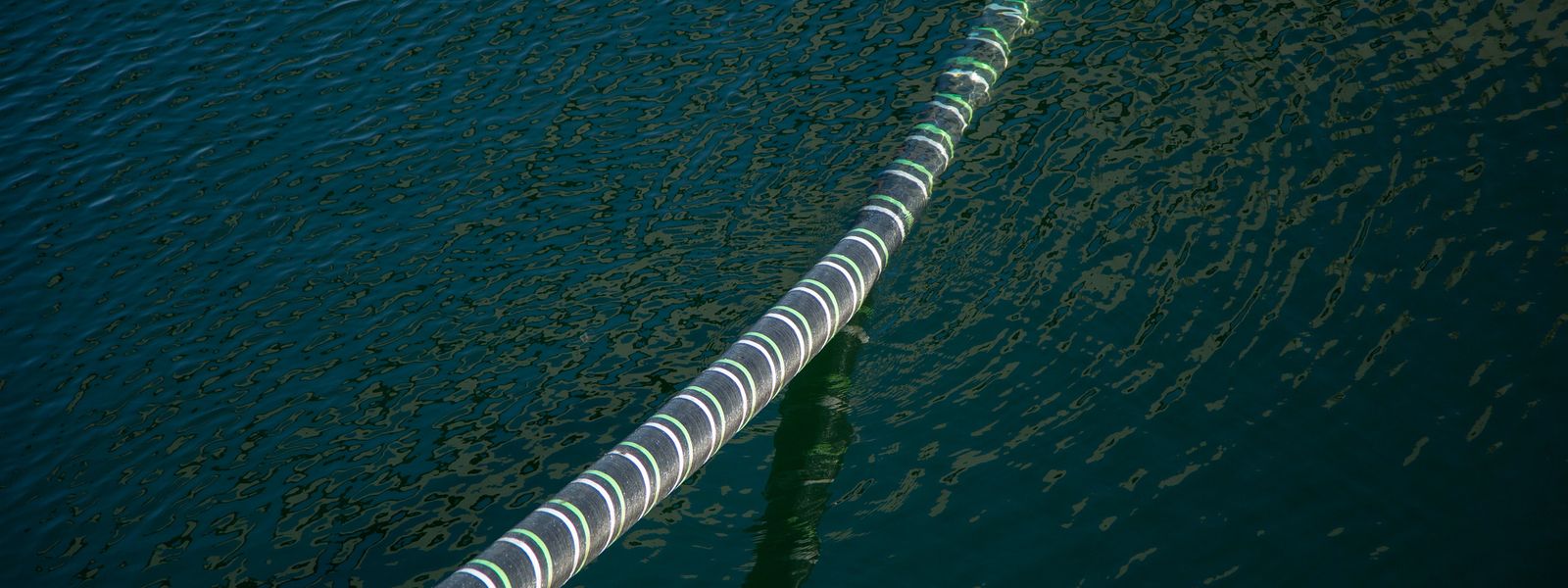 Cable Hanging Over Sea Water